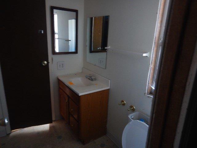 29947 Sprague River Road Chiloquin, OR 97624 - Photo 5 of 12 a bathroom with a sink and mirror with toilet