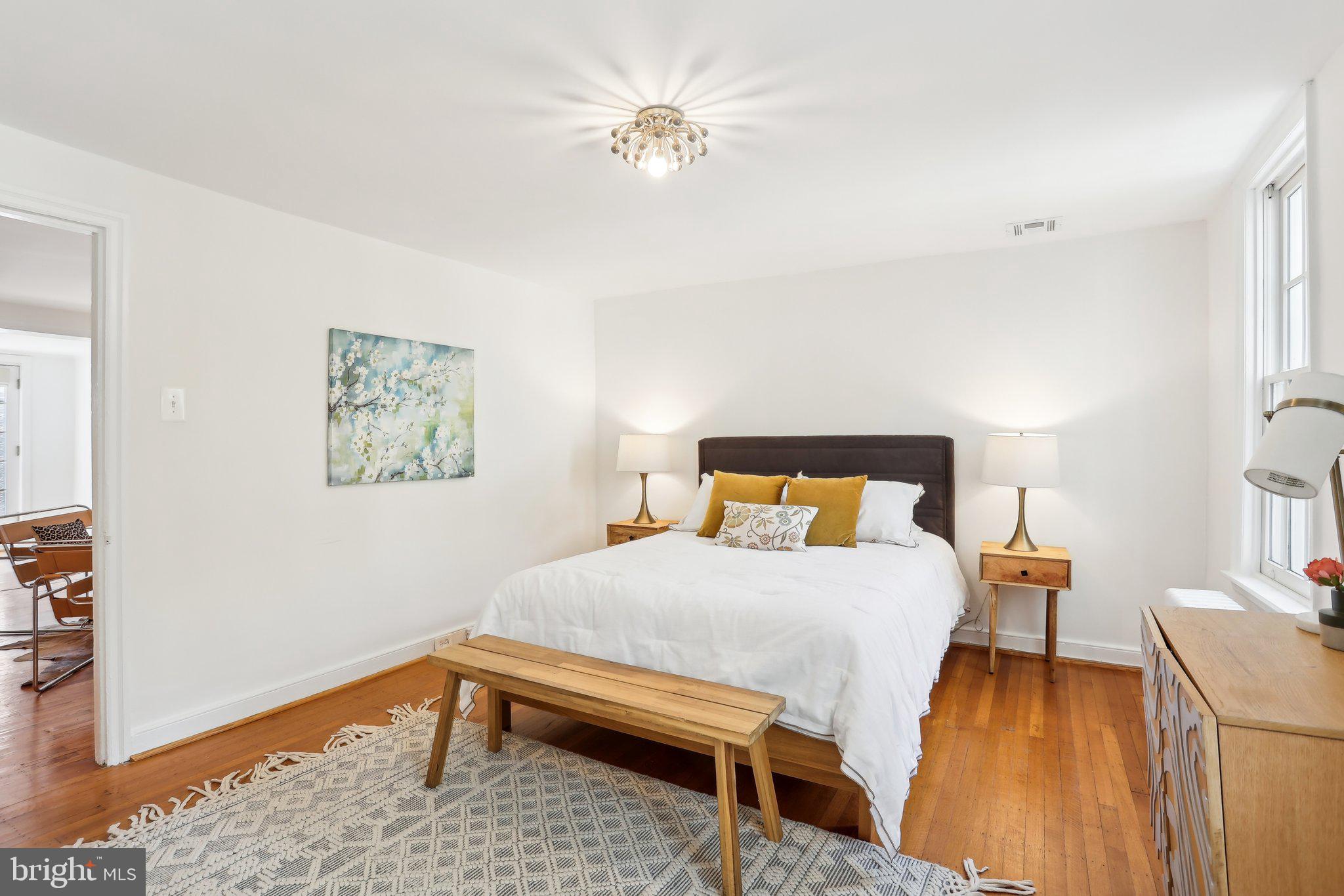 321 South Smedley Street Philadelphia, PA 19103 - Photo 22 of 39 a bedroom with a bed and a table in it