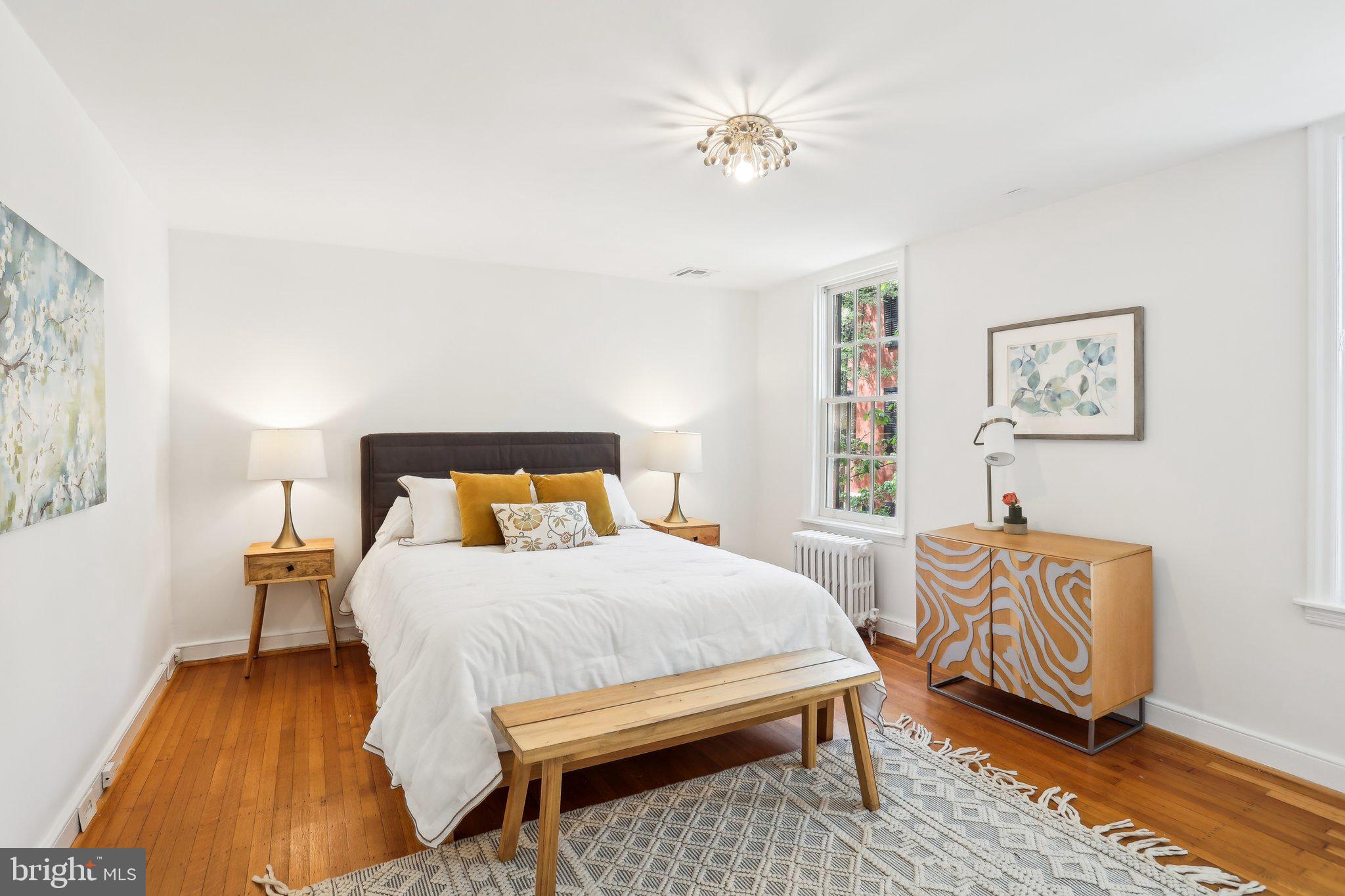 321 South Smedley Street Philadelphia, PA 19103 - Photo 23 of 39 a bedroom with a bed and a chandelier