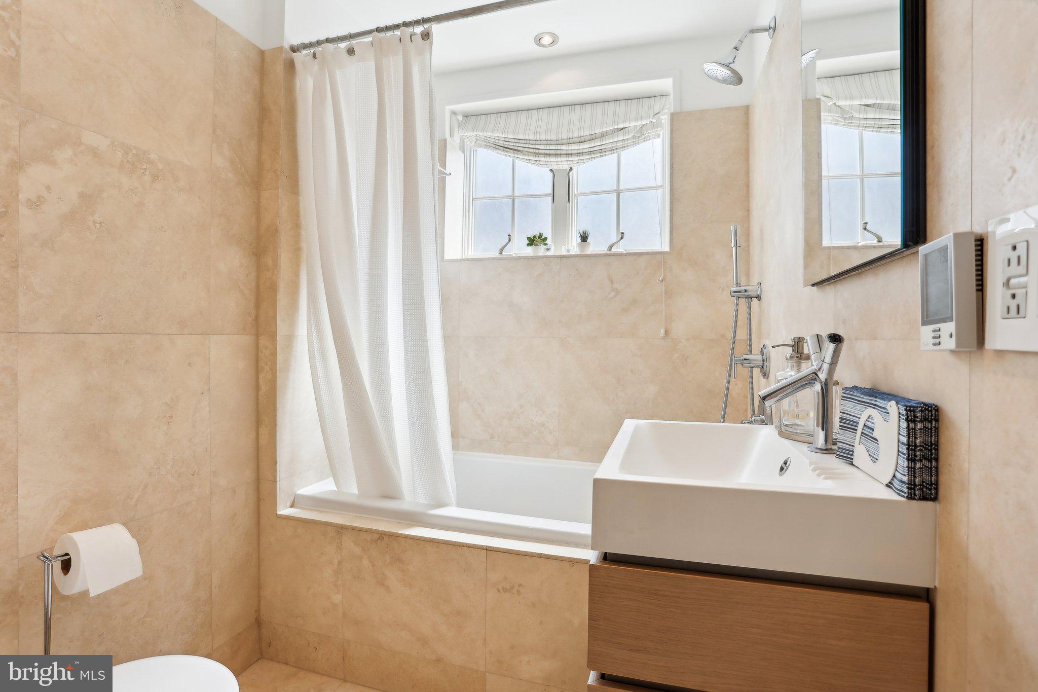 321 South Smedley Street Philadelphia, PA 19103 - Photo 24 of 39 a bathroom with a sink and a bathtub