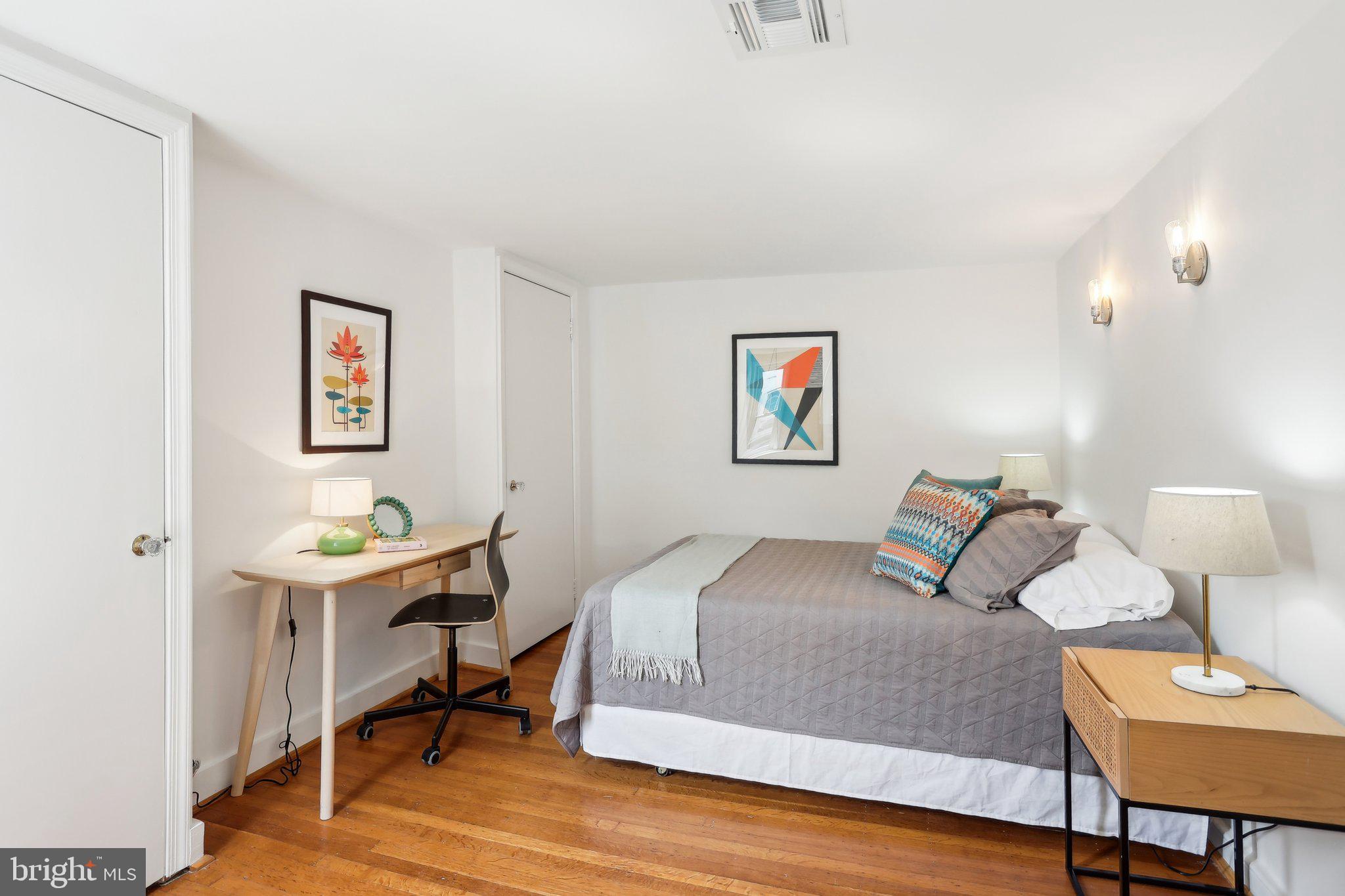 321 South Smedley Street Philadelphia, PA 19103 - Photo 26 of 39 a bedroom with a bed and a table in it
