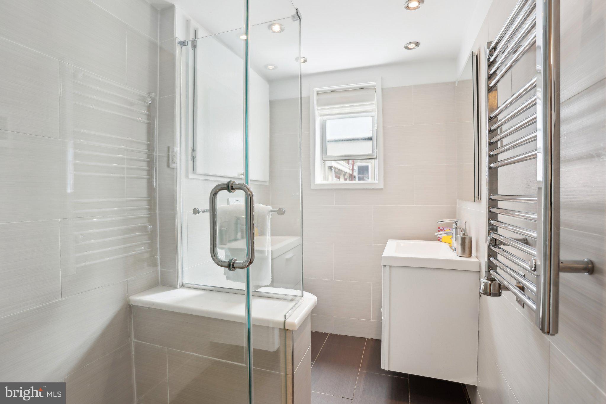 321 South Smedley Street Philadelphia, PA 19103 - Photo 32 of 39 a bathroom with a granite countertop sink toilet and shower