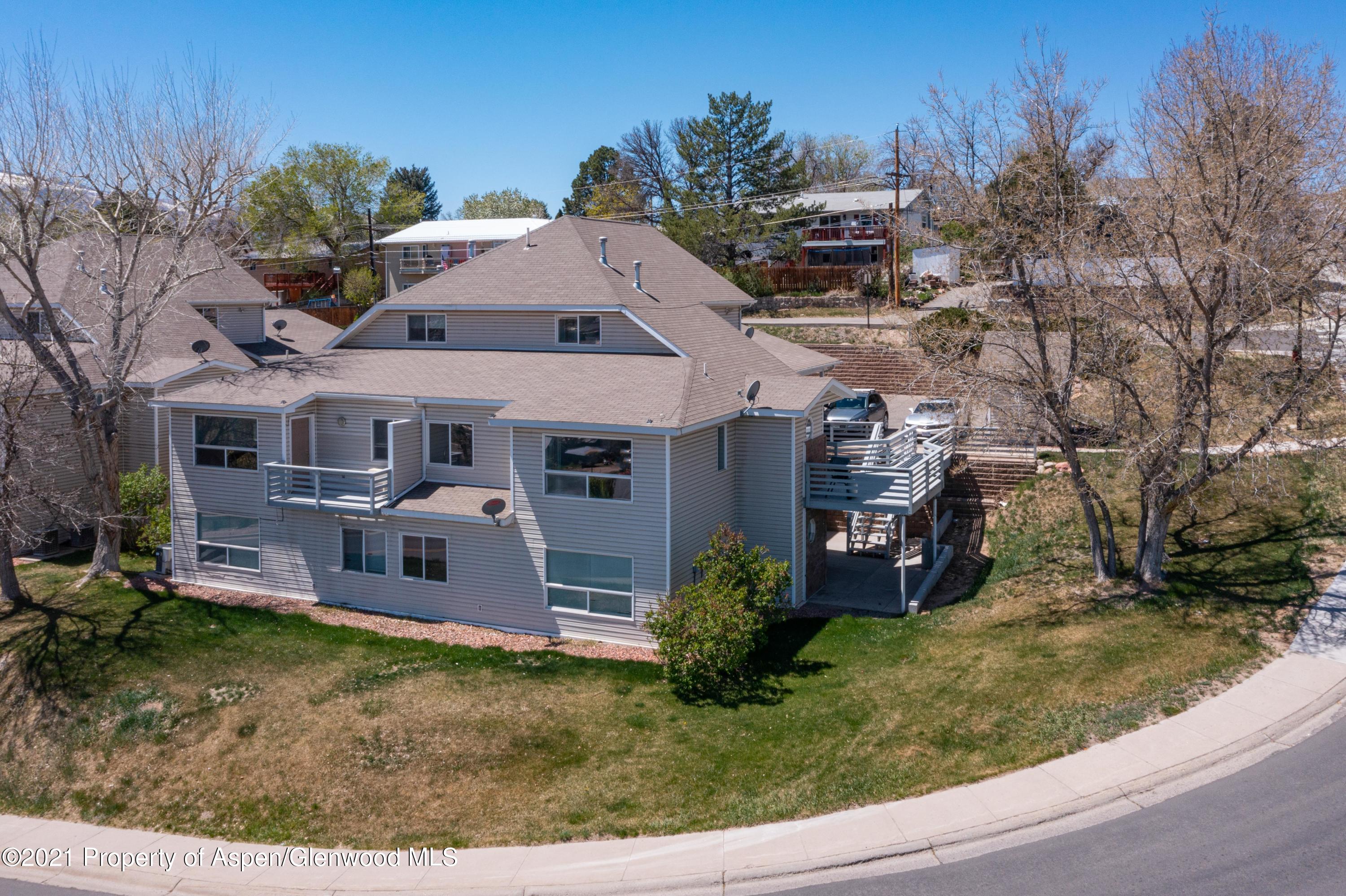 444 Lind Avenue Rifle, CO 81650 - Photo 1 of 13 front view of a house with a yard