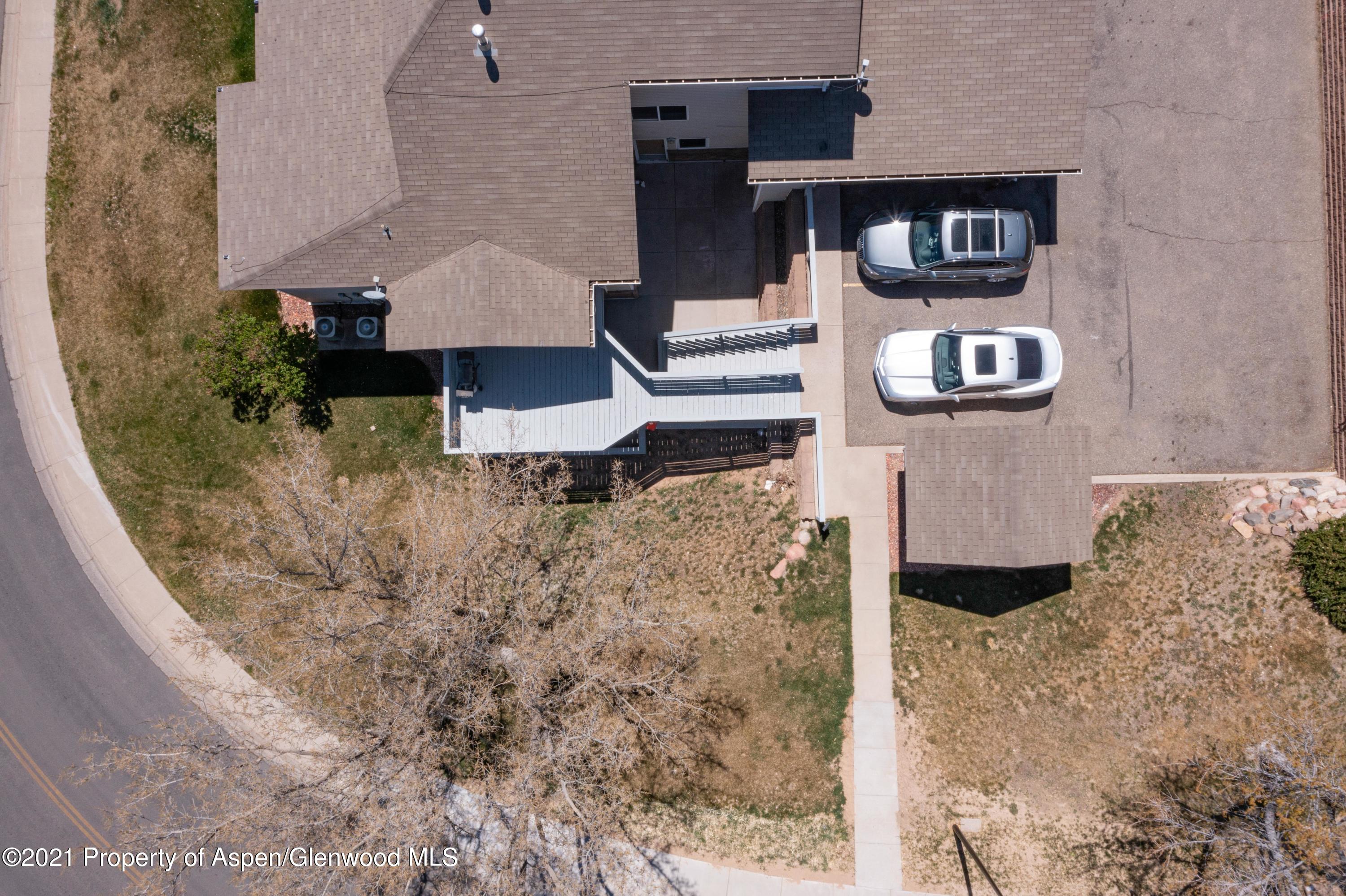 444 Lind Avenue Rifle, CO 81650 - Photo 13 of 13 a front view of a house with parking