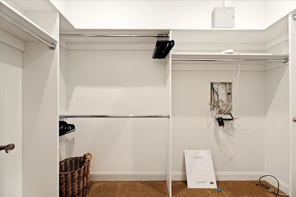 a spacious bathroom with a tub sink and mirror