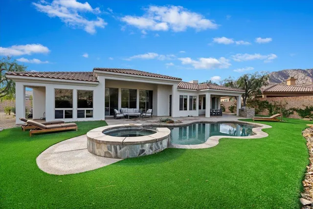 a view of a dining table and chairs in the patio