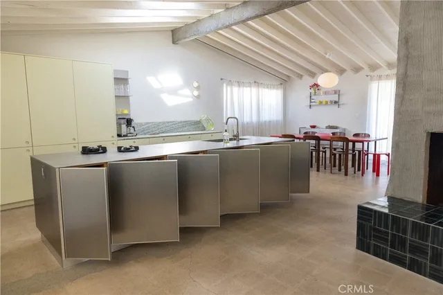 a kitchen with stainless steel appliances granite countertop a sink and cabinets