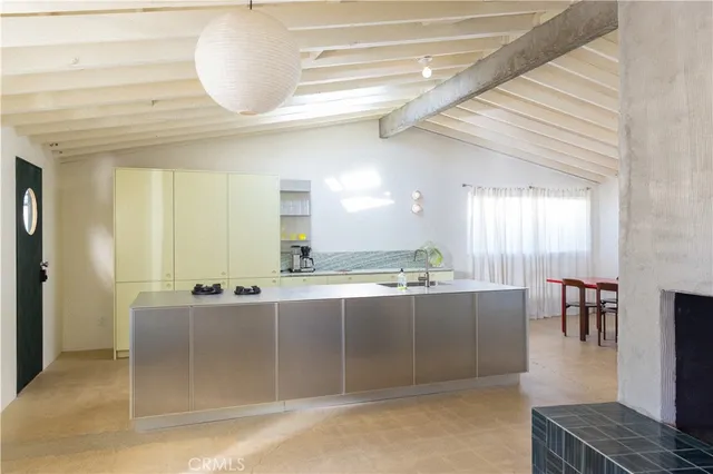a view of a dining room with furniture and window