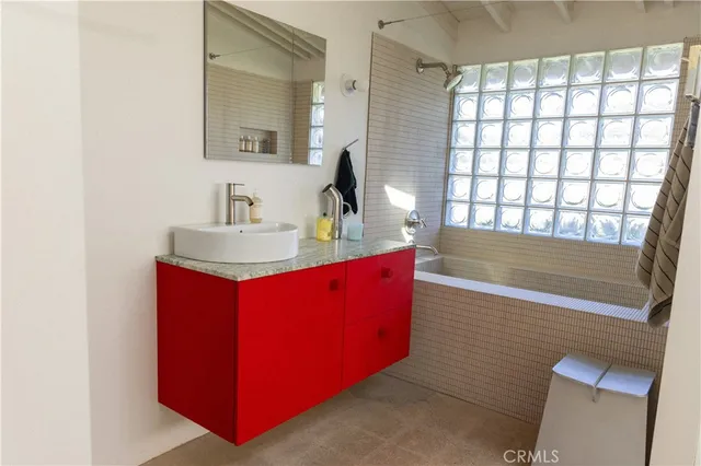 a bathroom with a shower toilet and sink