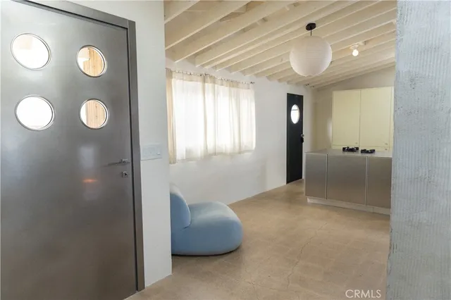 a living room with a couch and a view of living room