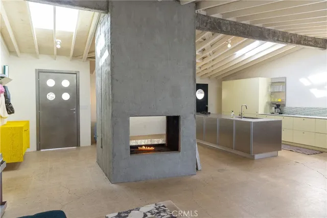 a bedroom with a bed and couch