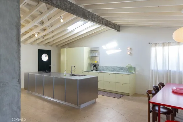 a living room with furniture a flat screen tv and a large window