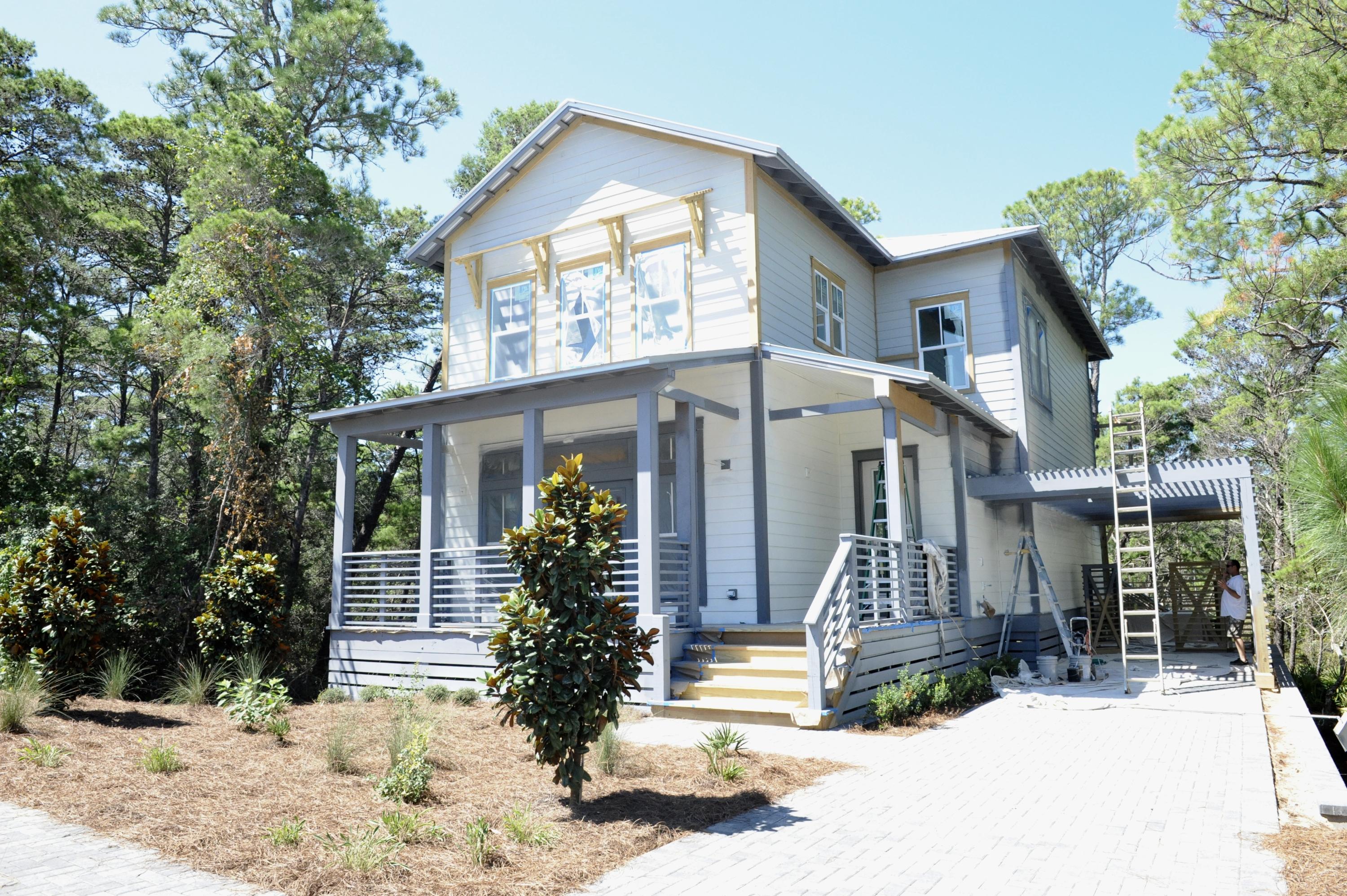40 Matt's Way Santa Rosa Beach, FL 32459 - Photo 3 of 18 a front view of a house with a yard