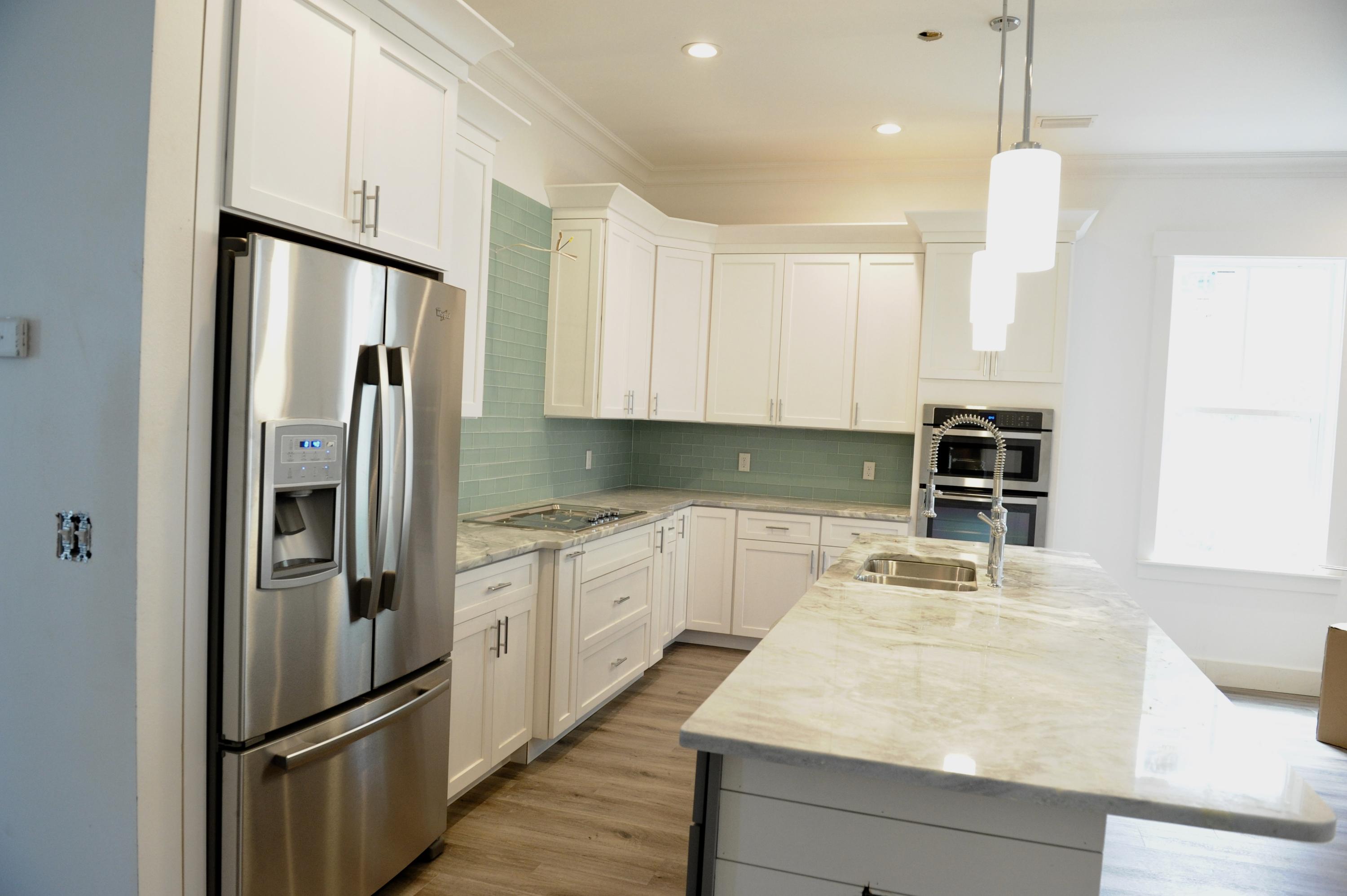 40 Matt's Way Santa Rosa Beach, FL 32459 - Photo 5 of 18 a kitchen with stainless steel appliances granite countertop a refrigerator and a sink