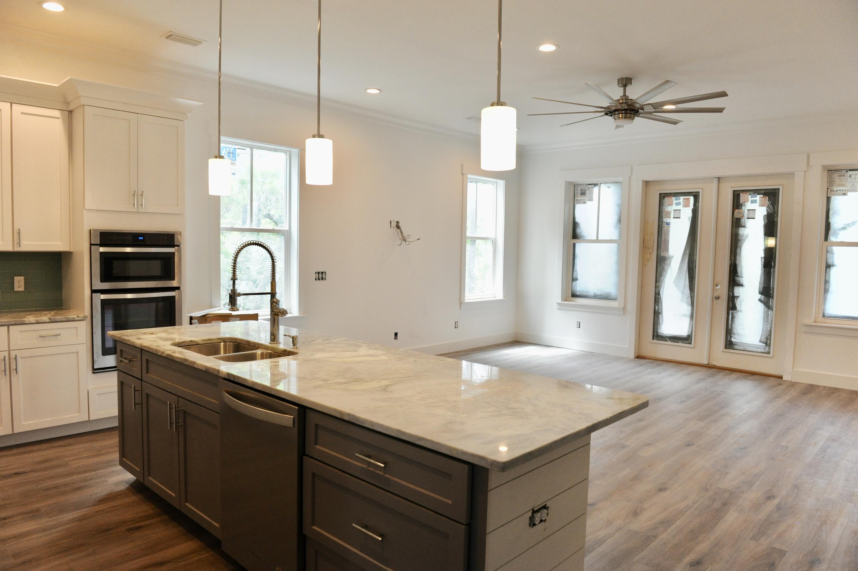 40 Matt's Way Santa Rosa Beach, FL 32459 - Photo 6 of 18 a kitchen with a sink a stove and cabinets