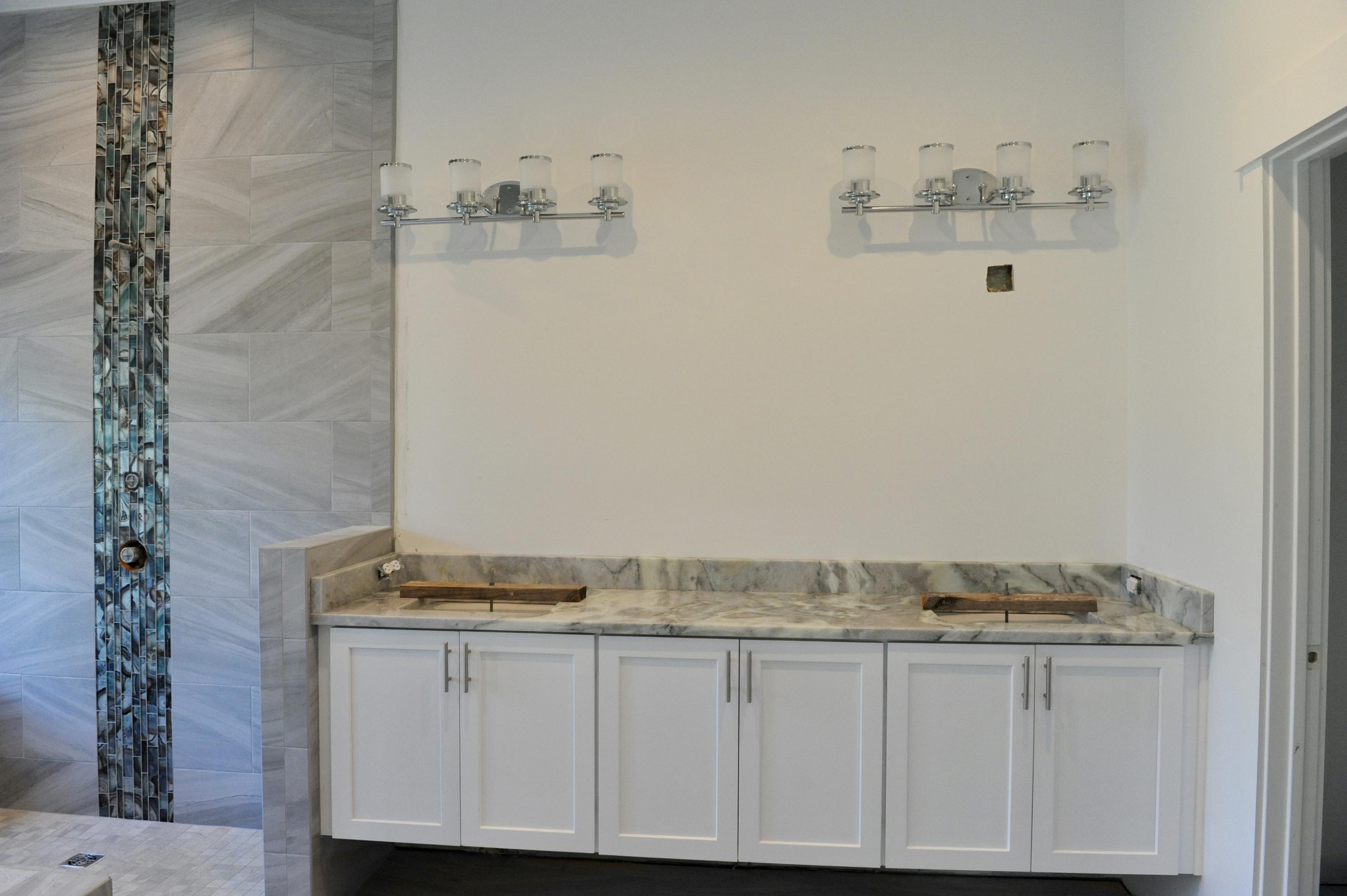 40 Matt's Way Santa Rosa Beach, FL 32459 - Photo 10 of 18 a bathroom with a granite countertop sink and a white cabinet