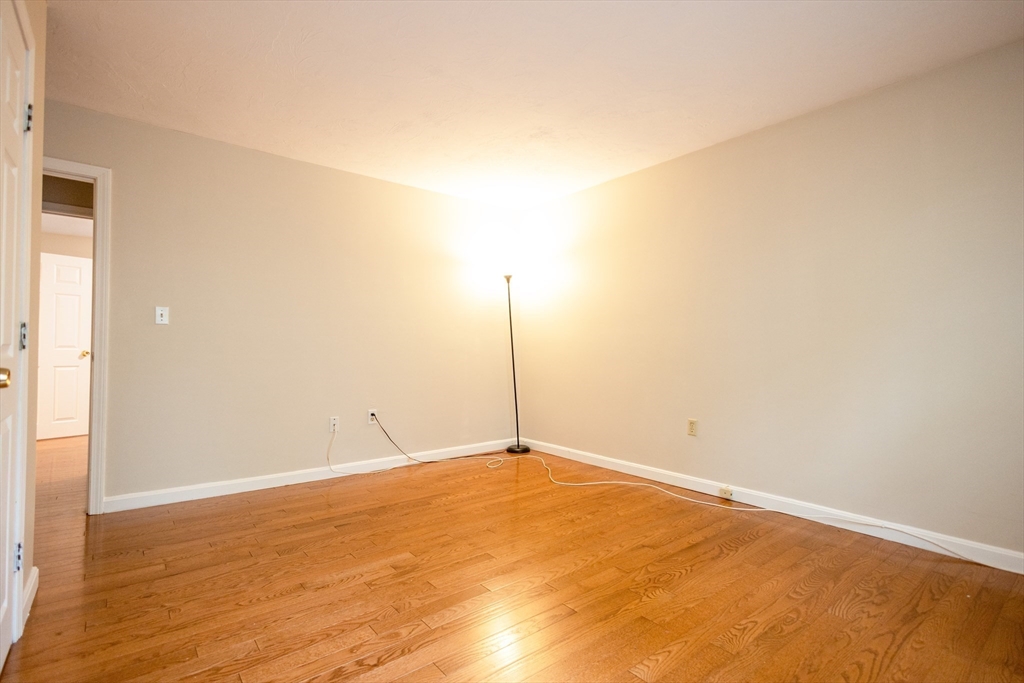 5337 B Washington Street, Unit B Boston, MA 02132 - Photo 26 of 41 a view of a room with wooden floor and window