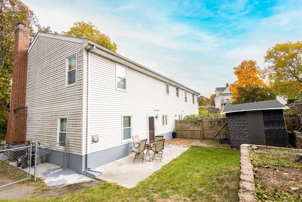 5337 B Washington Street, Unit B Boston, MA 02132 - Photo 32 of 41 a view of backyard of house with outdoor seating