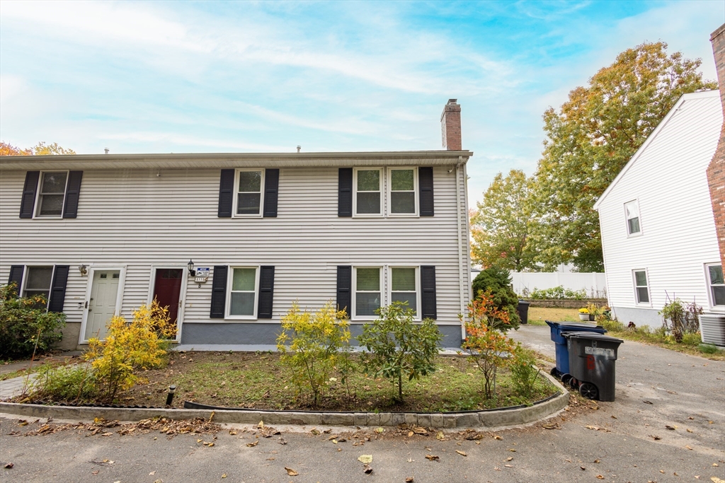 5337 B Washington Street, Unit B Boston, MA 02132 - Photo 35 of 41 a front view of a house with garden