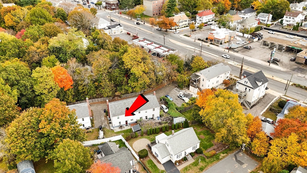 5337 B Washington Street, Unit B Boston, MA 02132 - Photo 40 of 41 an aerial view of a houses with swimming pool