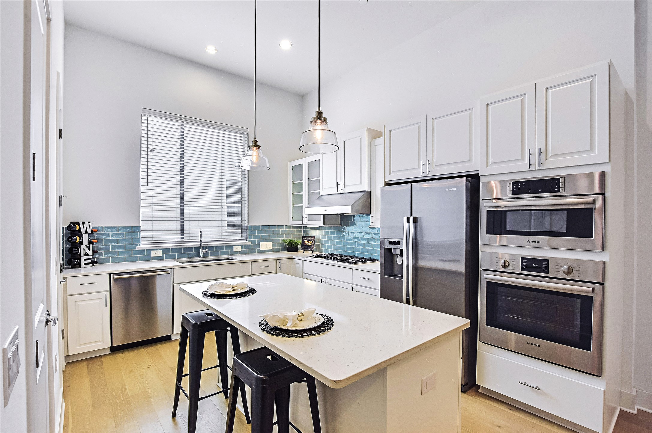 1308 Tinnin Ford Road, Unit 3 Austin, TX 78741 - Photo 5 of 37 Beautiful Modern Kitchen with white cabinets, quartz counters and stainless steel BOSCH appliances