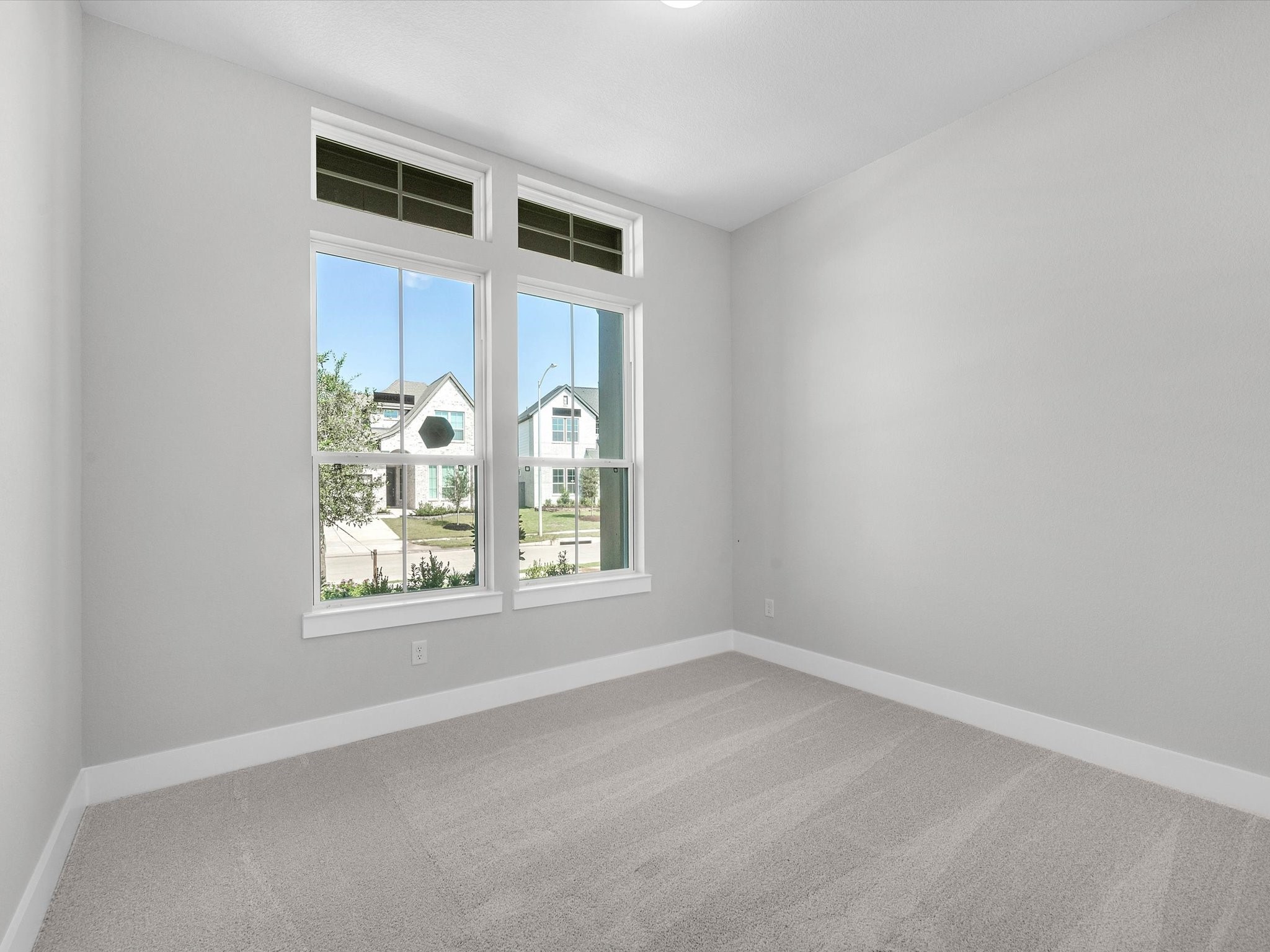 17242 Gleeful Street Hockley, TX 77447 - Photo 13 of 22 an empty room with windows