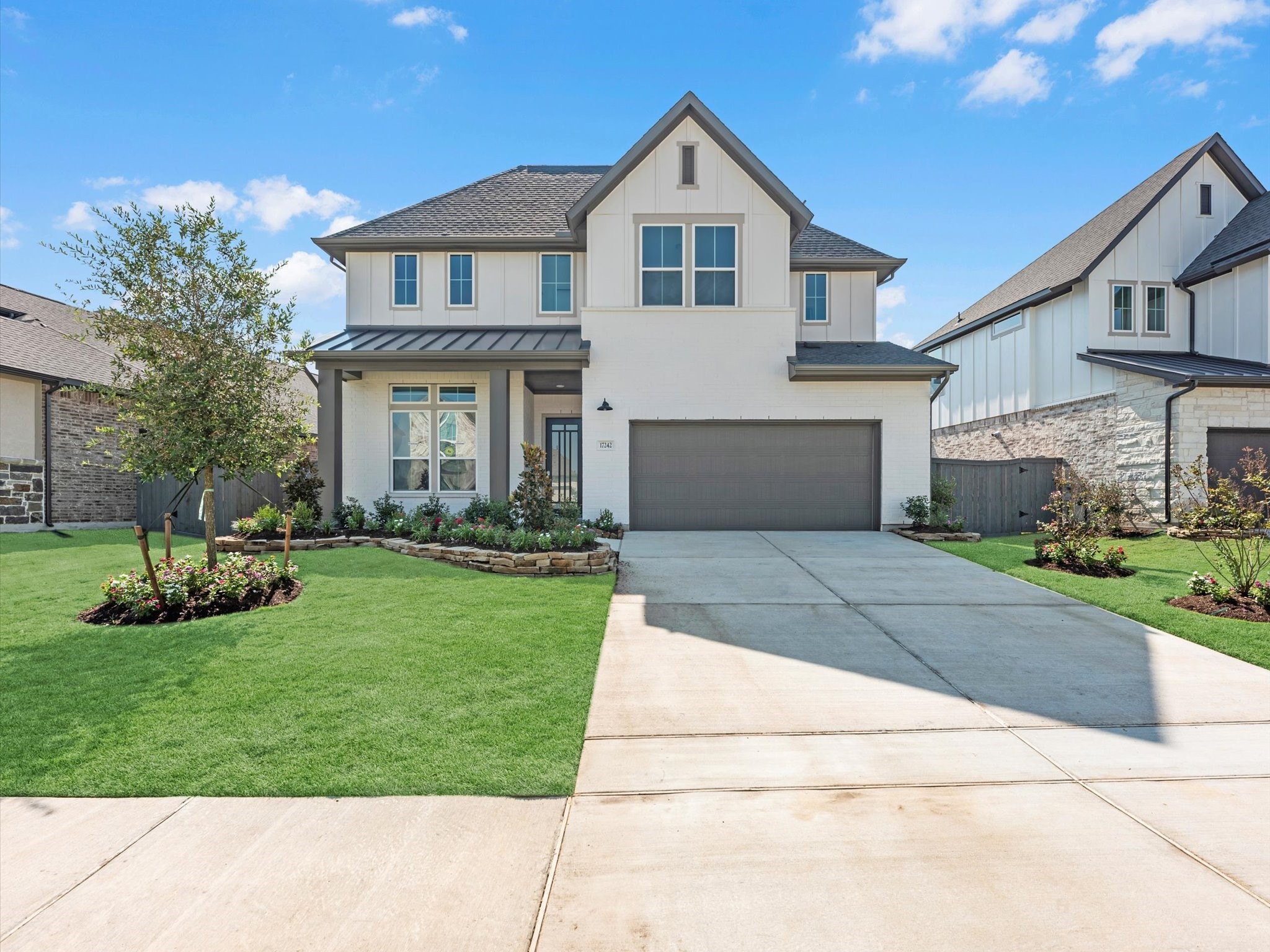 17242 Gleeful Street Hockley, TX 77447 - Photo 20 of 22 a front view of a house with a yard and garage