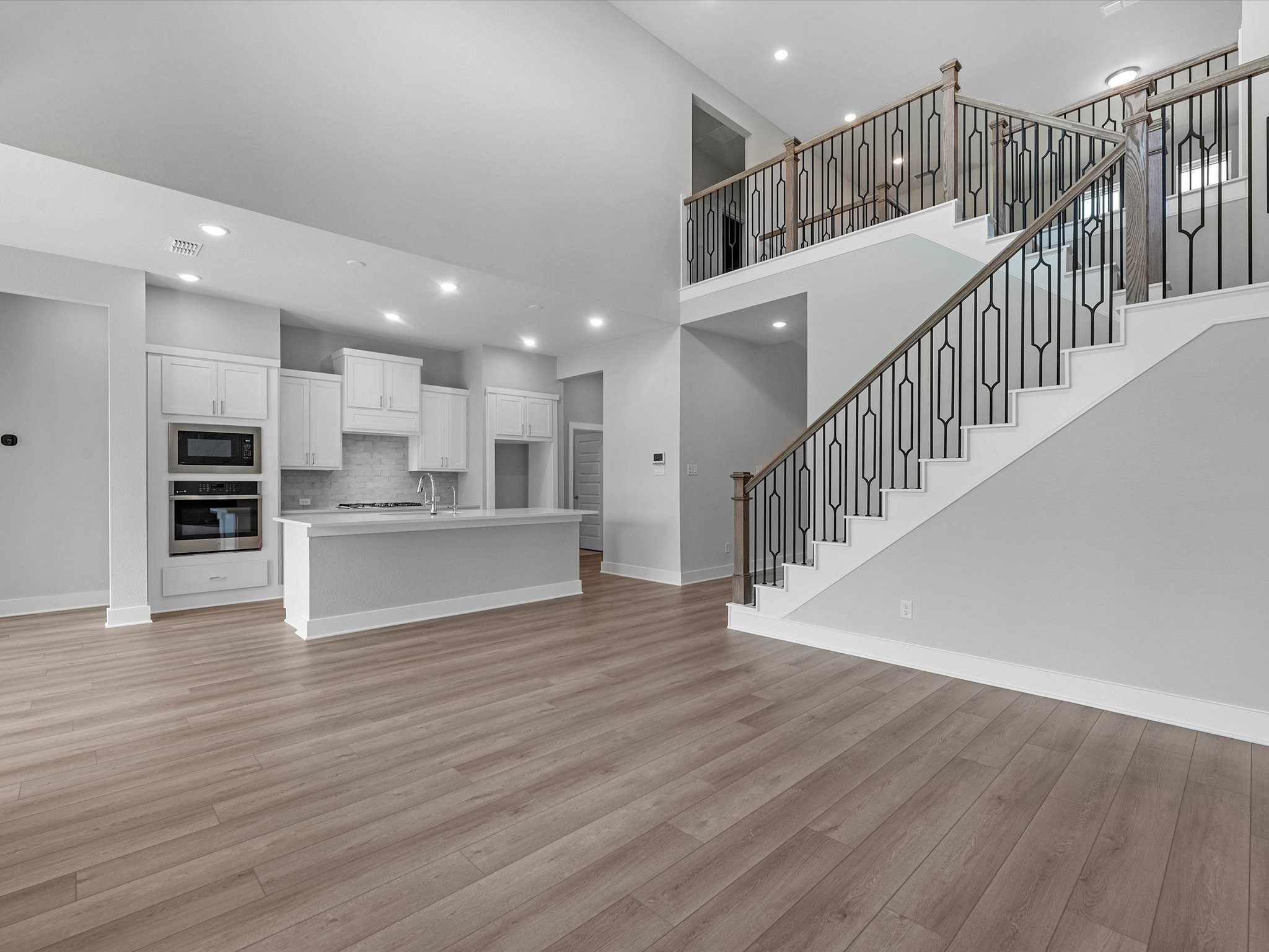 17242 Gleeful Street Hockley, TX 77447 - Photo 5 of 22 a view of kitchen with furniture and wooden floor
