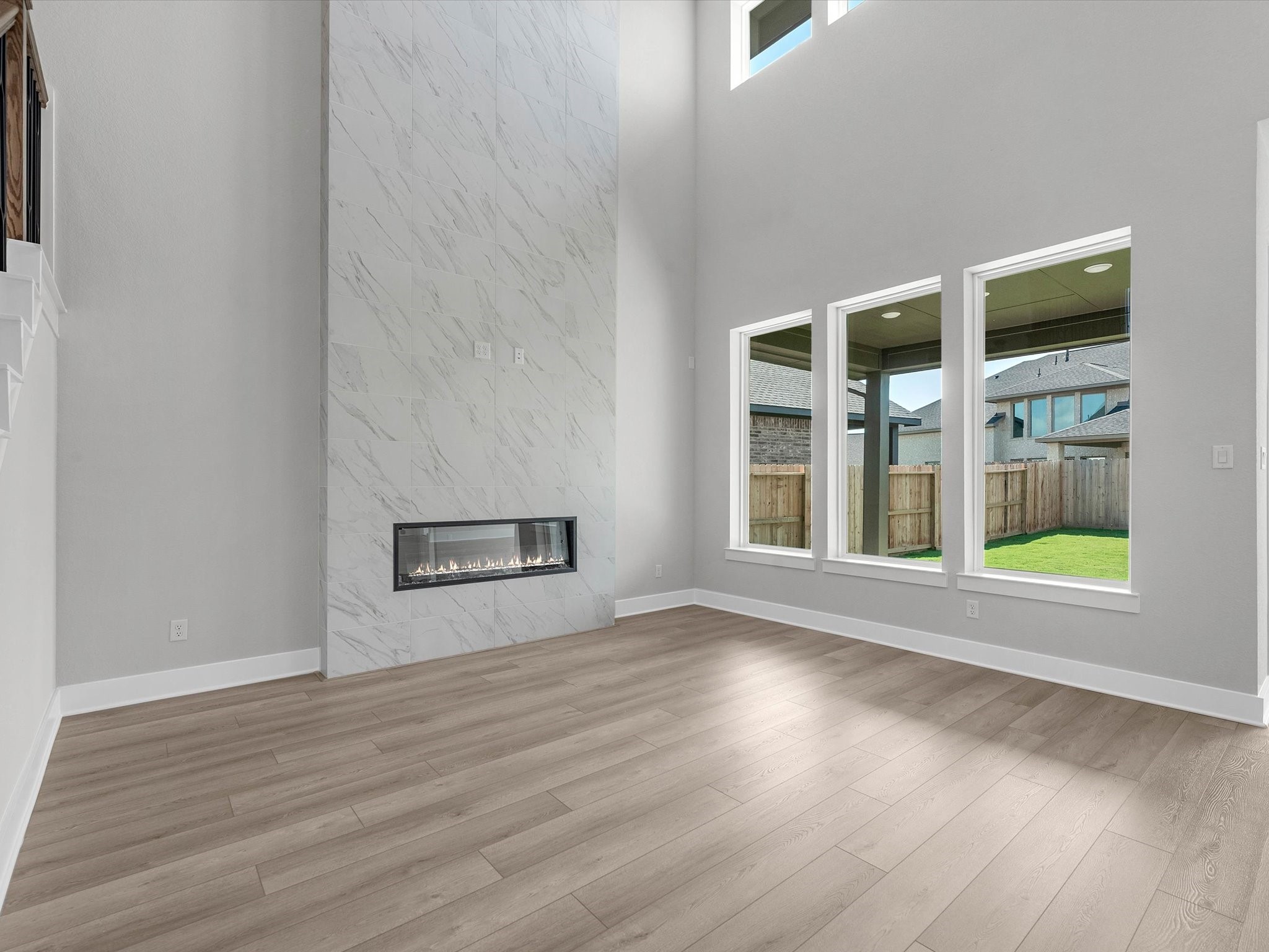 17242 Gleeful Street Hockley, TX 77447 - Photo 6 of 22 a view of an empty room with wooden floor and a window