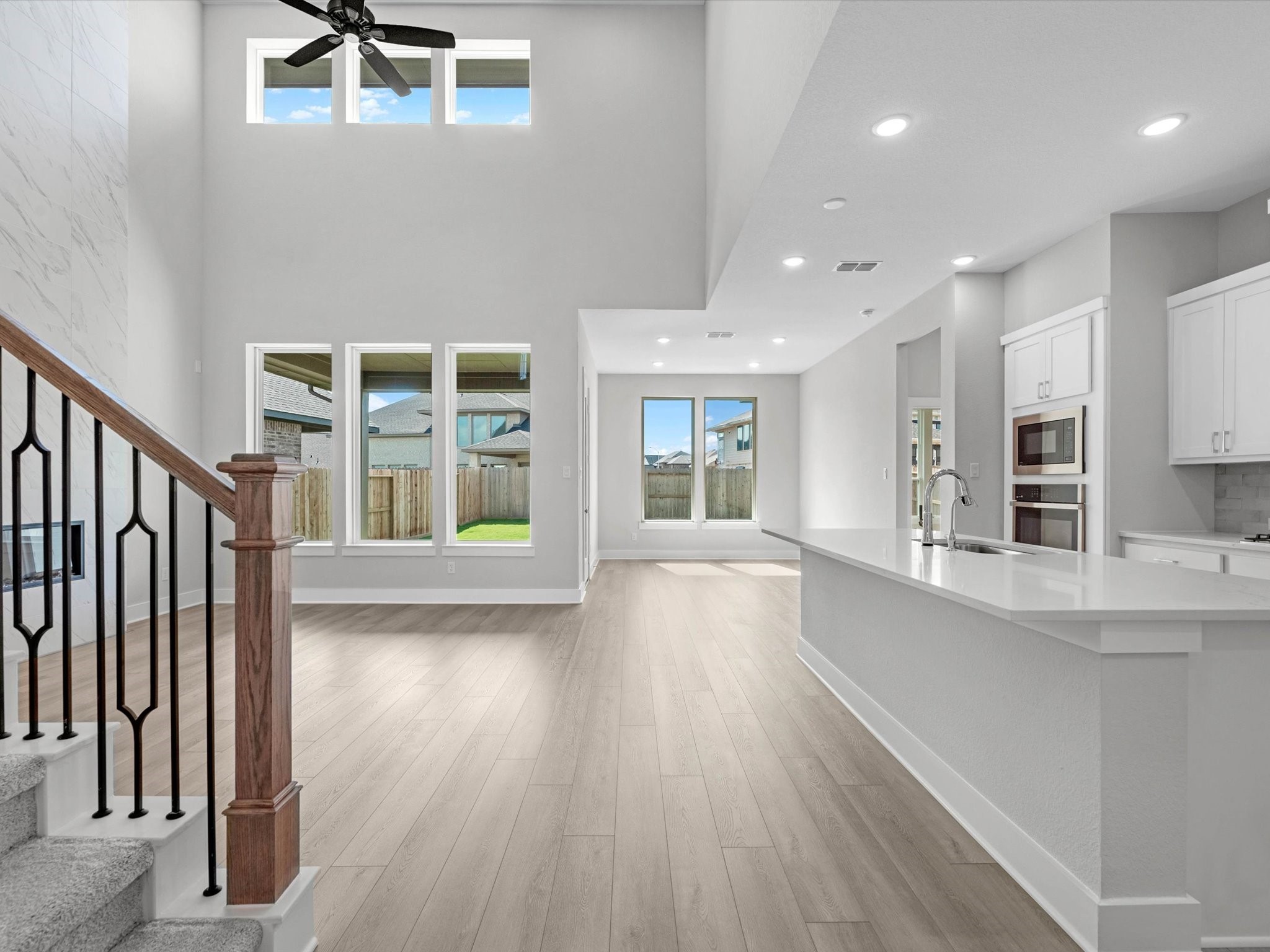 17242 Gleeful Street Hockley, TX 77447 - Photo 7 of 22 a view of wooden floor and windows in an empty room