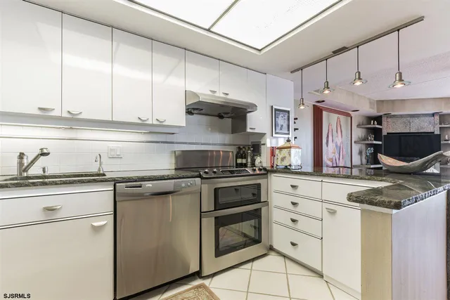 a balcony with table and chairs