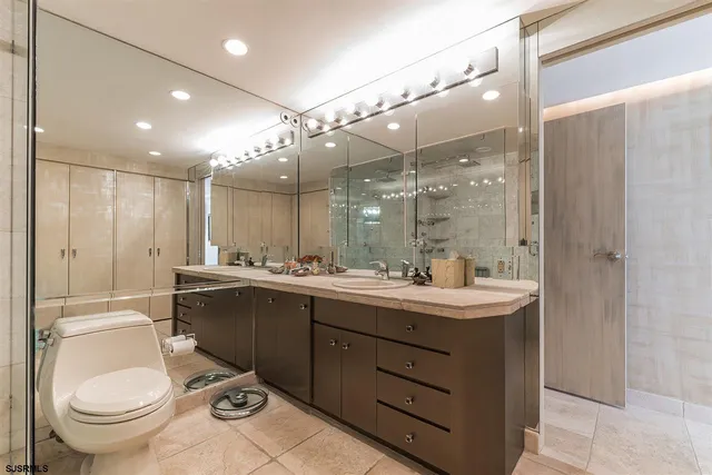 a bathroom with a shower a toilet and a sink