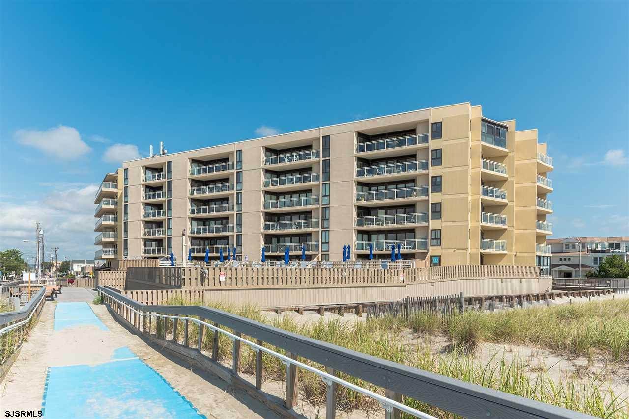 2700 Atlantic Avenue, Unit 419 Longport, NJ 08403 - Photo 2 of 32 a view of building with swimming pool and outdoor space