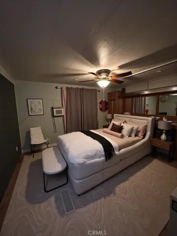 a bedroom with a bed and furniture