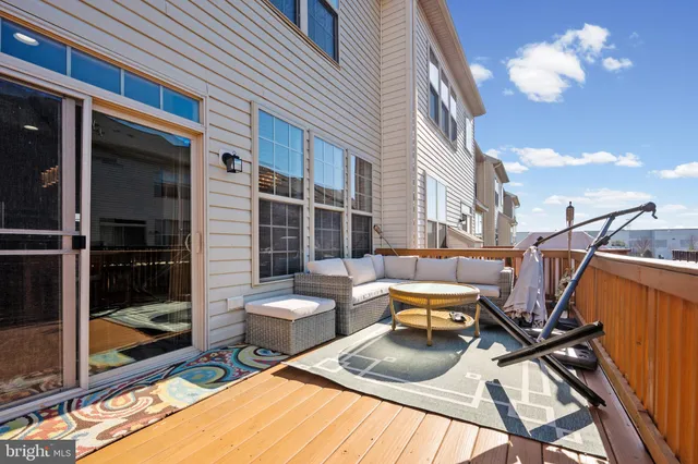 a view of a patio with a table and chairs