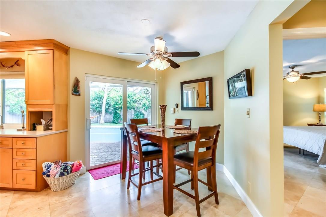 1401 Southwest 17th Street Boca Raton, FL 33486 - Photo 3 of 24 a view of a dining room with furniture window and wooden floor