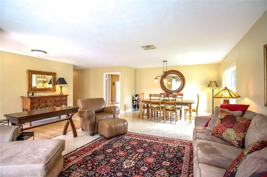 1401 Southwest 17th Street Boca Raton, FL 33486 - Photo 8 of 24 a living room with furniture a clock and a large window