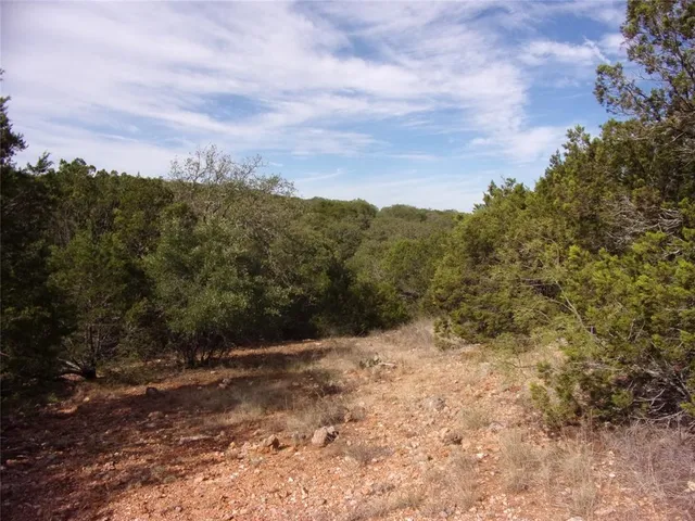 a view of mountain covered with fog
