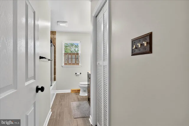 a bathroom with a toilet sink and shower
