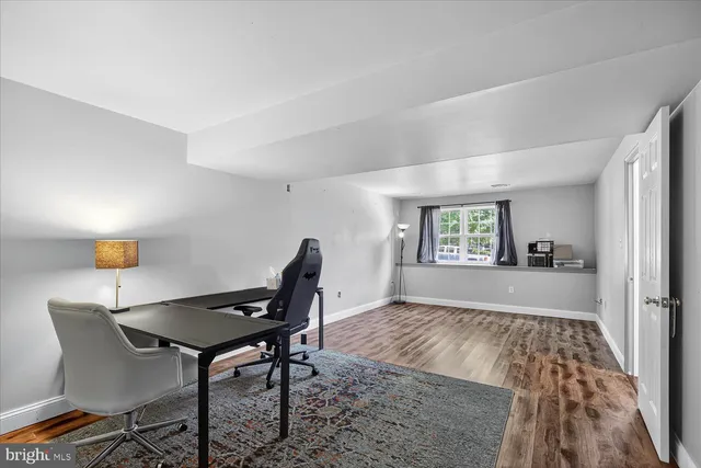 a workspace with furniture and window