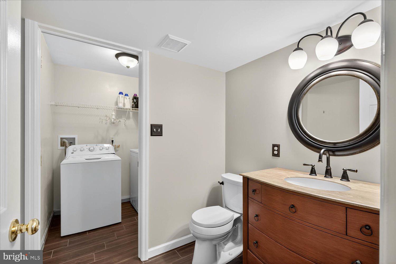 554 Mallard Drive Manheim, PA 17545 - Photo 17 of 21 a bathroom with a sink mirror and toilet