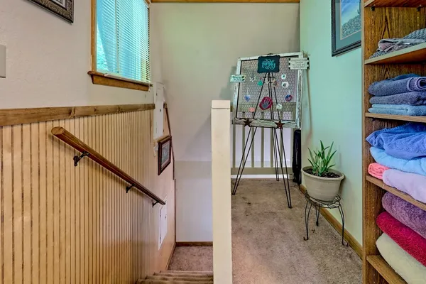 a view of entryway and hall with wooden floor