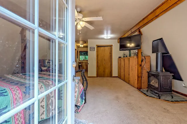 a bedroom with furniture and a window