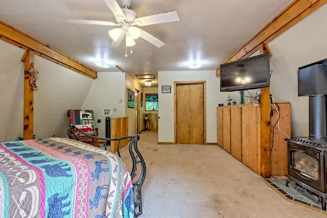 a view of a patio with table and chairs potted plants with wooden floor and fence