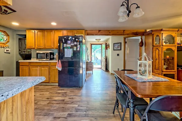 a kitchen with stainless steel appliances granite countertop a stove and a sink