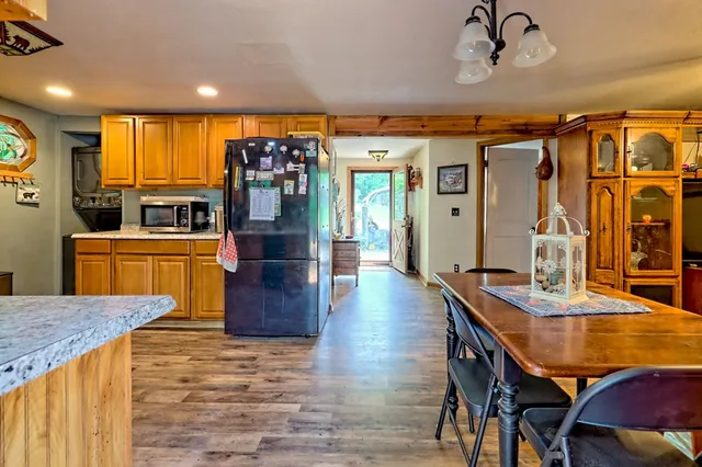a kitchen with stainless steel appliances granite countertop a stove and a sink
