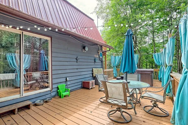 a view of a dining room with furniture and chandelier