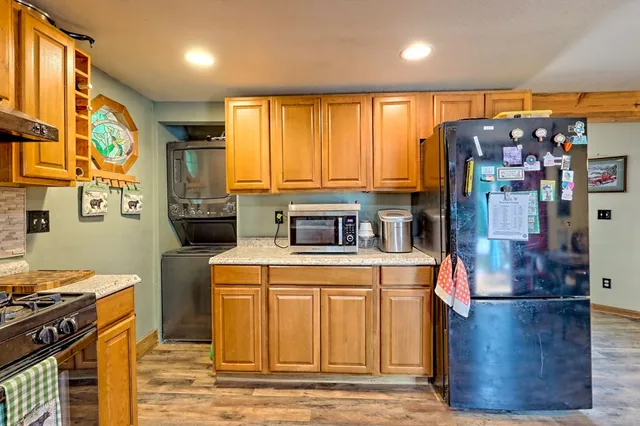 a very nice looking room with many windows and furniture