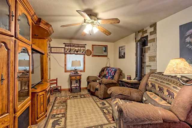 a view of a house with backyard and sitting area