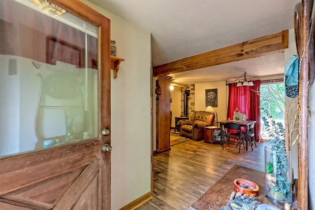 a view of a house with backyard and sitting area